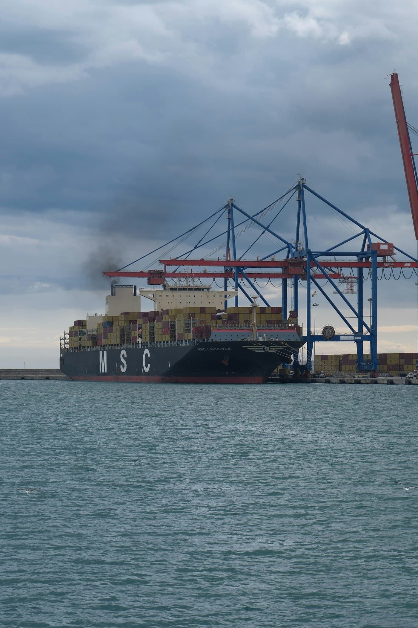 Container ship loading at port
